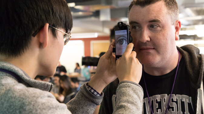 Two students look at a computer together