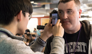 Two students look at a computer together